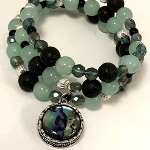 Handmade jade, glass and stone on memory wire.